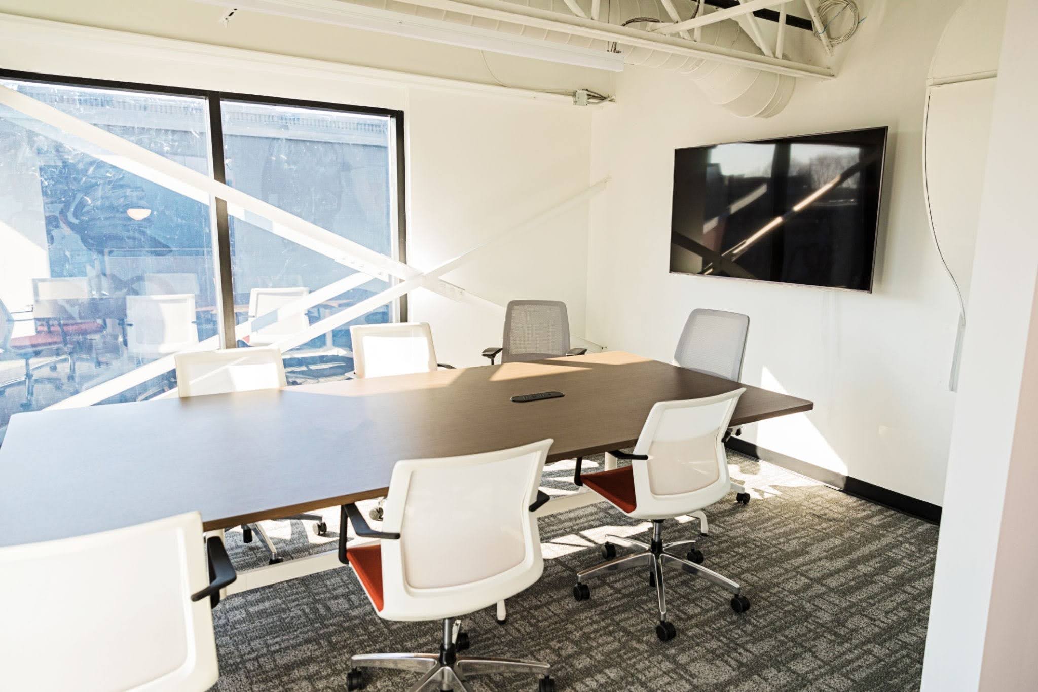Soundproof coworking meeting room in Tulsa set up for confidential business meetings